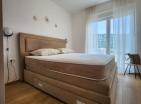 Потрясающая новая квартира с 2 спальнями площадью 58 м2 с видом на море в Будве